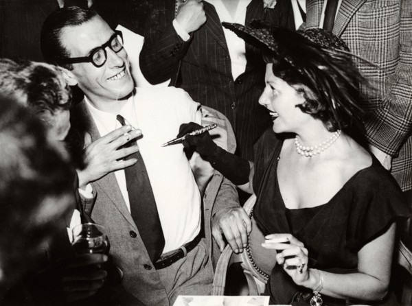 Rita HAYWORTH gives autograph