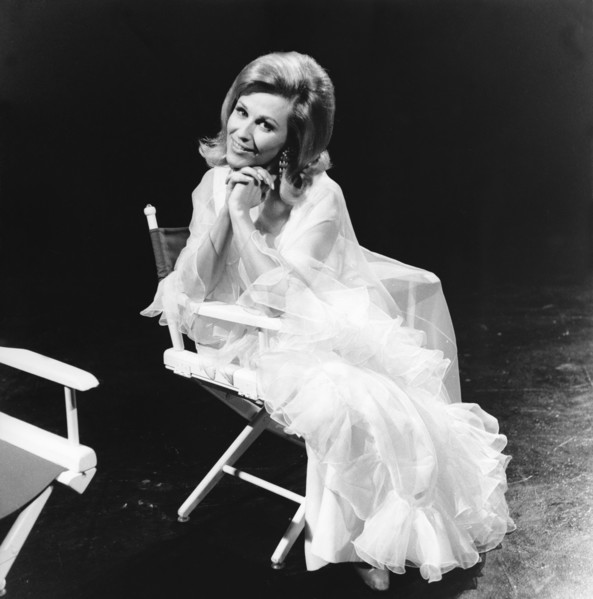 Bibi JOHNS in a director's chair