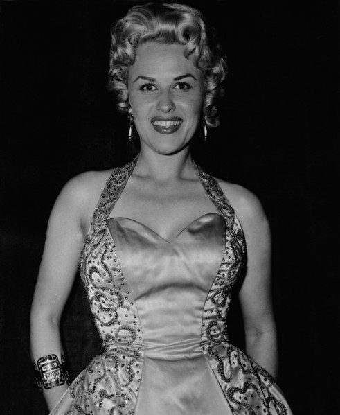 Bibi JOHNS in an evening dress for a celebratory occasion