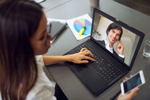 Businessman is working in remote with a videocall due to quarantine of coronavirus covid19. Concept of smart working