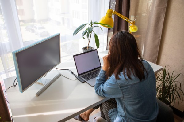 woman working on laptop at home office