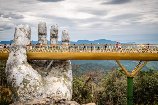 The Golden Bridge /Vietnamese: C?u Vàng) is a pedestrian bridge located in the Sun World resort in Bà Nà Hills near Da Nang in Vietnam.