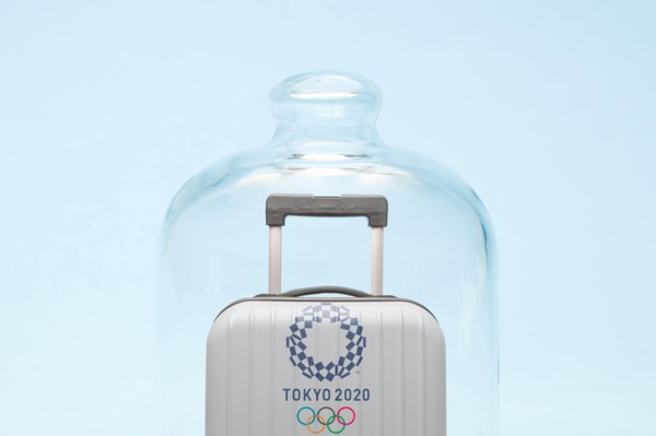 Belgrade, Serbia - 19th April 2020": suitcase with Tokyo 2020 Olympic rings in quarantine, coronavirus and travel restrictions concept.