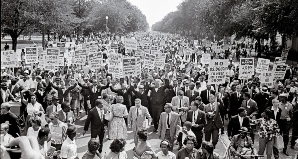 Leaders of the 1963 March on Washington for Jobs and Freedom raise their hands together as they move along Constitution Avenue in Washington, DC on August 28, 1963. Some of the leaders in the march, f...