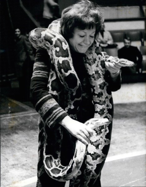 Apr. 04, 1970 - Regine as snake charmer: Regine, the famous French singer entertainer is back in Paris after a singing tour in America. She will participate in the annual charity show organised by the...