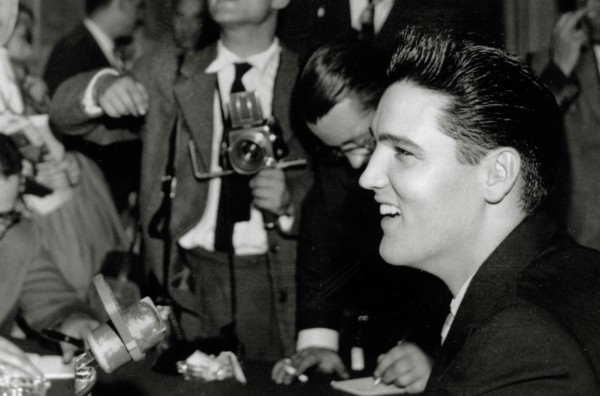 Elvis Presley at a press conference in Paris, France (circa 1958) 
File Reference # 33848-389THA