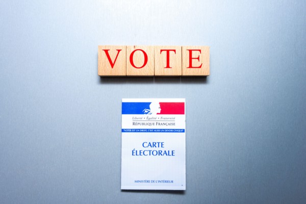 French voting card or carte electorale with wooden blocks and the word vote on them