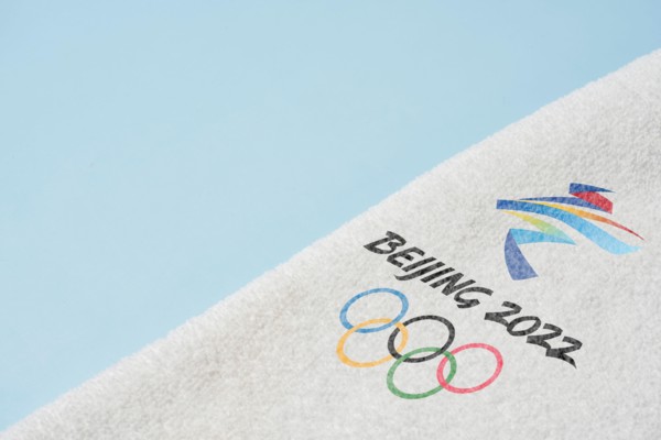14 December 2021 - Los Angeles, USA: Beijing 2022 Winter Olympic Games and towel. International sport event. Winter Olympics 2022 in Beijing, China