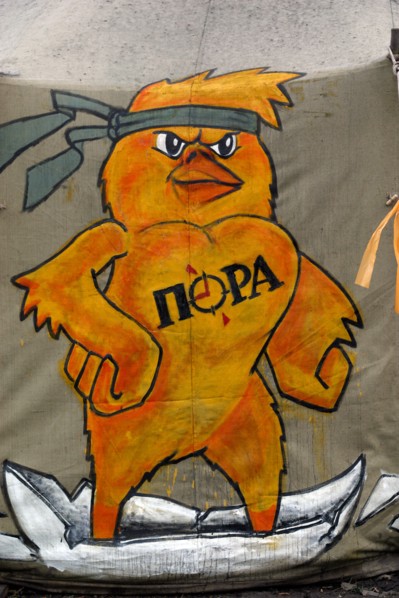Ukraine, URK, Kiev, 03.01.2005. Painted orange chick with the sign of the All-Ukrainian youth public organization "PORA".