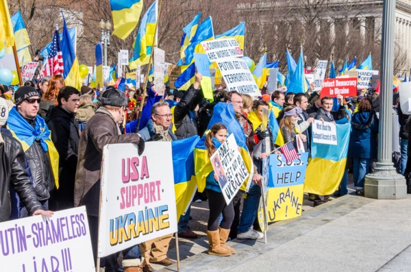 Washington DC, USA - March 6, 2014: People holding sign of Vladimir Putin and Russia during Ukrainian protest by White House