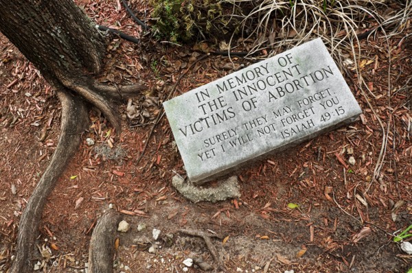 abortion grave marker in garden of church