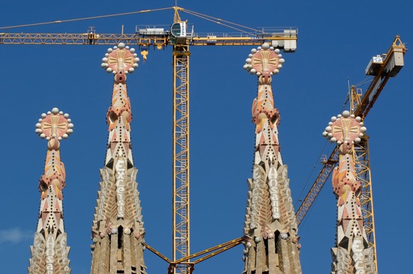 Artistic Tower of Sagrada Familia with crane