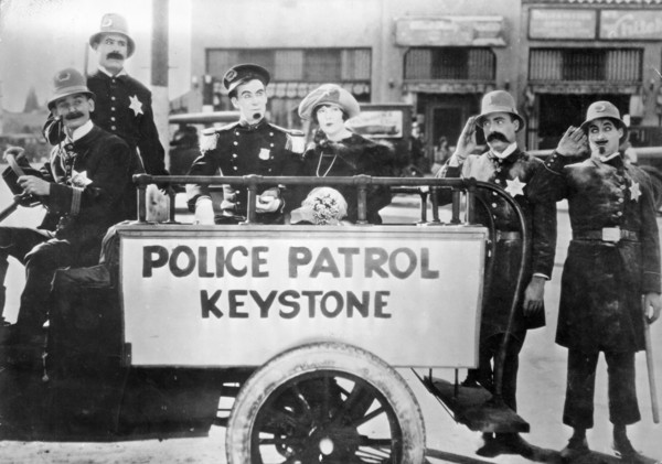 Keystone Cops, Tillie's Punctured Romance still from the 1914 Mack Sennett first full length silent movie with the iconic incompetent police and starring Mabel Normand and Charlie Chaplin