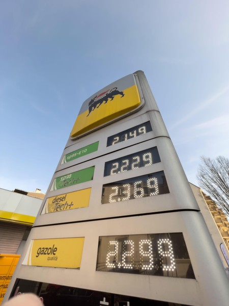 Strasbourg, France - Mar 11 2022: View from below of Italian Eni gas station with new prices at the pump exceeding all expectations. The war in Ukraine has pushed fuel prices above the two-euro thresh...
