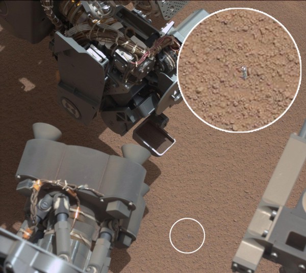 View of Curiosity's First Scoop Also Shows Bright Object This image from the right Mast Camera