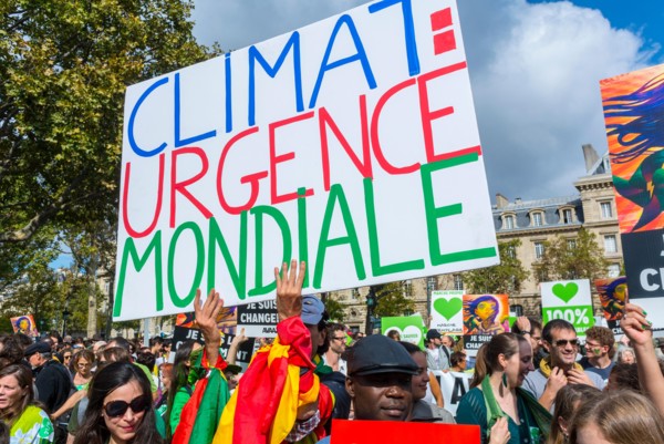 Paris, France. Crowd of Protesters holding French protest poster  at Public Ecology Demonstration, International NGO, UN Climate March Protest, global problem