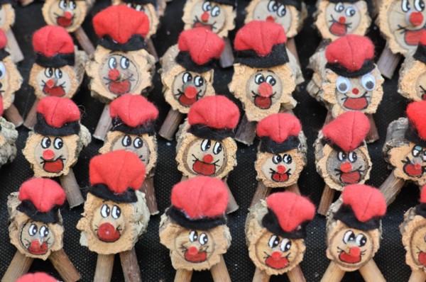 Tions de Nadal (Christmas logs), Catalan tradition, for sale at fair. Fira de Santa Llúcia, Barcelona, Catalonia, Spain