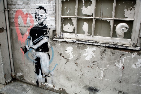 Banksy stencil of boy painting heart, Islington, London