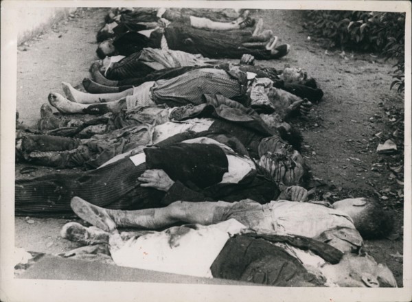 Nov. 11, 1937 - Bodies laid out for burial after Insurgent planes had bombed a school in Barcelona during Spanish civil war. Cr