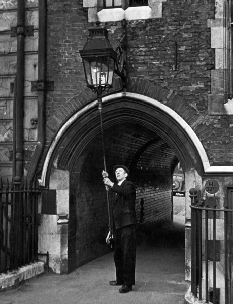 The lamplighter, Mr G Allwn who is employed by the Gas, Light and Coke company and has put on the lights in the Temple for the past 28 years Circa 1950