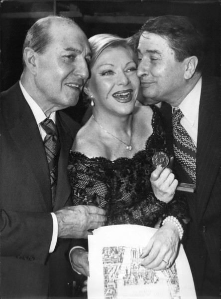 Jan. 20, 1977 - Singer Line Renaud, who is going to reach 300 shows at the Paris Casino, received a Vermeil Medal. She was awarded it for her excellence as leader in French music. Here she is with Cou...