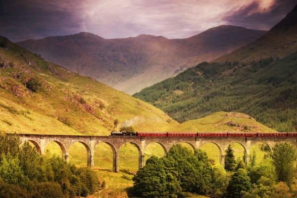 Jacobite steam train crossing Glenfinnan viaduct