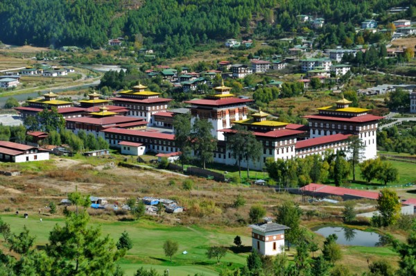 View of Thimphu Dzong over golf course, Bhutan