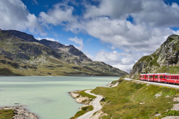 The Glacier Express train winds its way around the rocky mountain lakes of Switzerland