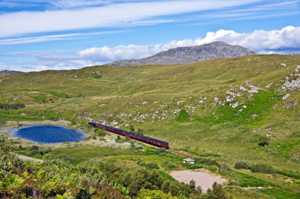 The afternoon Jacobite steam train heading towards Mallaig from Morar in the west highlands of Scotland