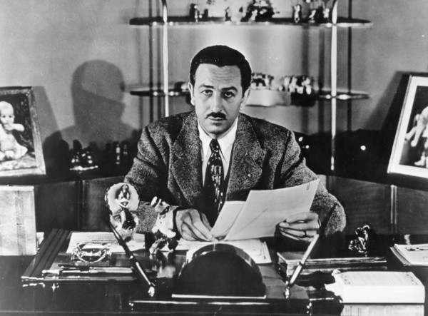 Walt Disney sitting in his office