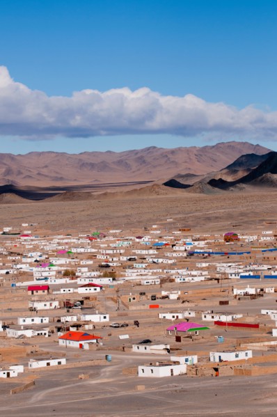Outer suburbs of Olgii with some new houses among traditional homes.