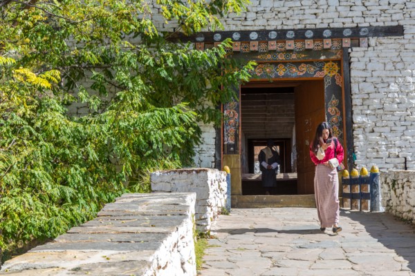 Paro, Bhutan.  Covered Bridge Leading to the Paro Dzong (Fortress).