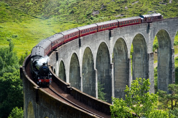 The Jacobite Express also known as the Hogwarts Express crosses the Glenfinnan Viaduct on route between Fort William and Mallaig.
