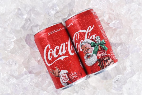 IRVINE, CALIFORNIA - DECEMBER 17, 2017: Two cans of Coca-Cola Christmas cans. The limited edition cans feature Santa Claus for the Holiday Season.
