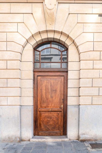 Paris, an old wooden door, typical building in the center