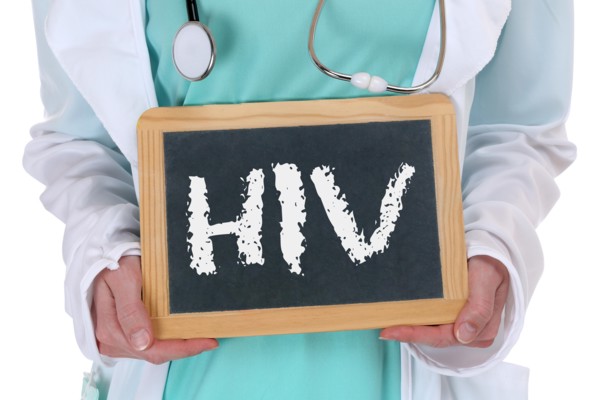 HIV AIDS diagnosis disease ill illness healthy health doctor nurse with sign