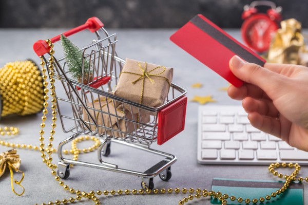 Small red shopping cart with keyboard for Internet online shopping concept christmas gifts. save time.