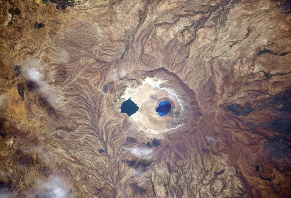 A view of Earth from the International Space Station: Isolated and colourful caldera lakes somewhere between Sudan and Chad, Africa Ê An optimised and digitally enhanced version of a NASA/ ESA image. ...