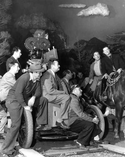 BRIAN DONLEVY and ROBERT CUMMINGS on set candid with Camera / Movie Crew including Cinematographer KARL STRUSS  (centre) during filming of HEAVEN ONLY KNOWS 1947 director ALBERT S. ROGELL Nero Films /...