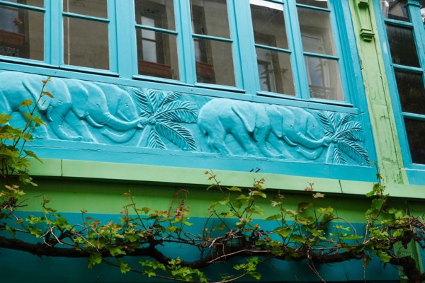 La Cité du Figuier, hidden street with colorful architectural detail, a place where mostly metal workers had shops during the 19th century, Paris.