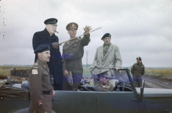 The Visit of the Prime Minister, Winston Churchill To Caen, Normandy, 22 July 1944 The Commander of the British 2nd Army, Lieutenant General Sir Miles Dempsey, pointing out a section of the front to t...