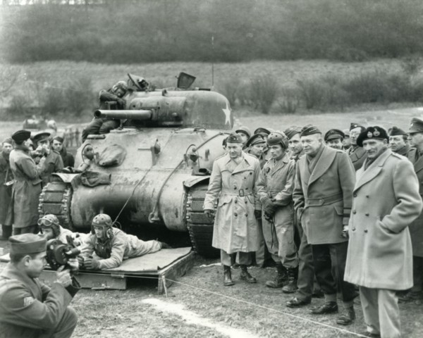 GENERALS EISENHOWER and Montgomery at right watching US troops exercising at Warminster on 28 February 1944