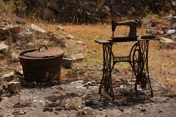 The remains of a Singer sowing machine and a cooking pot in the martyred village of Oradour sur Glane Limousin France