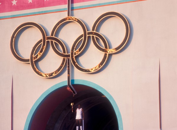 Rafer Johnson brings Olympic torch to light flame during opening ceremonies at 1984 Olympic Games in Los Angeles.