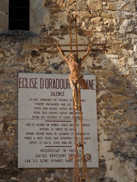 Oradour sur Glane war memorial village ruins, Haute Vienne, France with memorial sign on the church.