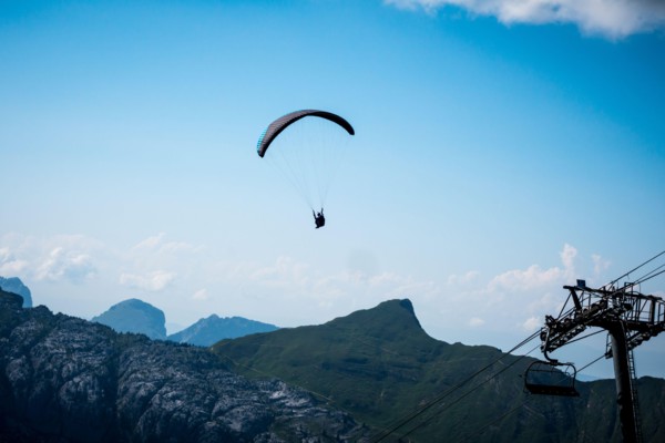 Paragliding flight in the mountains. Le Grand-Bornand, France