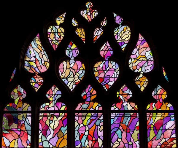 ABBEVILLE, SOMME, FRANCE, JUNE 20, 2023 :  details of stained glasses windows in Saint Sepulcre church, by Alfred Manessier workshop, year 1989  to 19