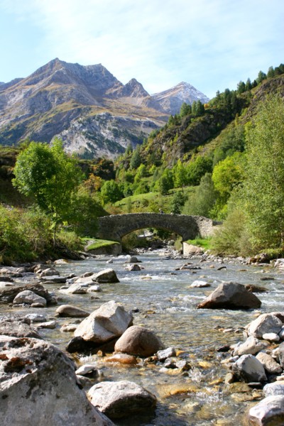 Bridge over stream Gavarnie foothills of Pyrenees France