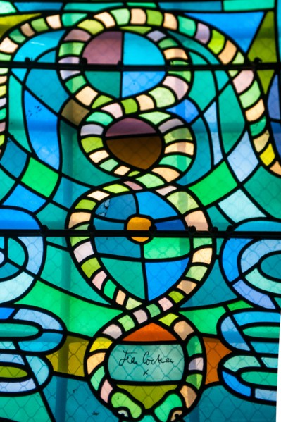 Colorful stained glass windows done by Jean Cocteau in a chapel in Metz, France