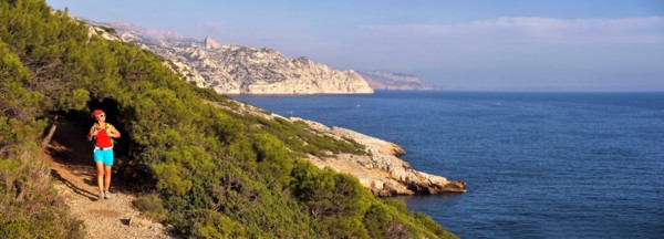 female wanderer walking on footpath along the rocky coast, France, Provence, Calanques National Park, Marseille Cassis La Ciotat